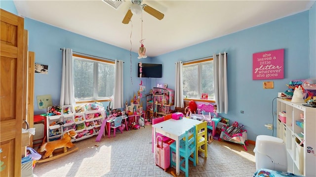 playroom featuring light colored carpet and ceiling fan