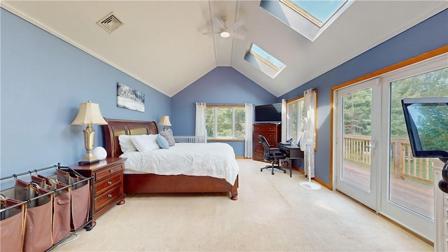 carpeted bedroom featuring high vaulted ceiling, a skylight, access to outside, and multiple windows