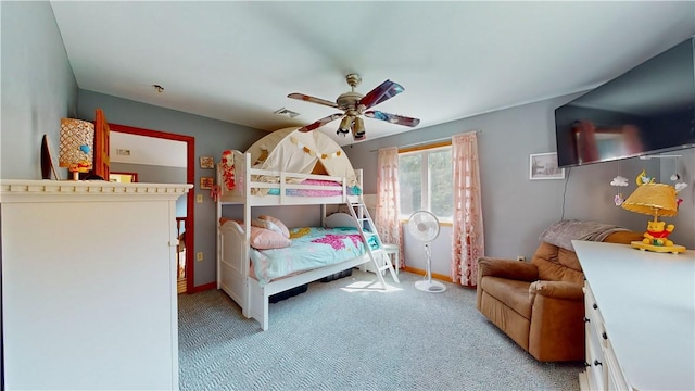 bedroom featuring light colored carpet and ceiling fan