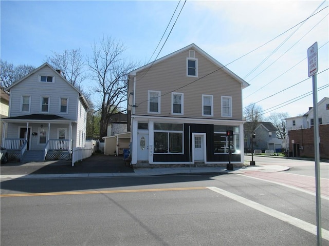 view of property featuring covered porch