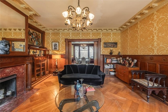 living room with parquet flooring, crown molding, and a premium fireplace