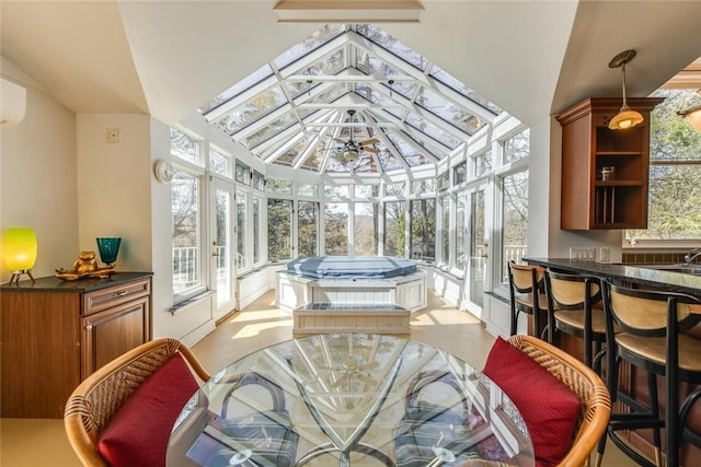 sunroom / solarium with lofted ceiling and a healthy amount of sunlight