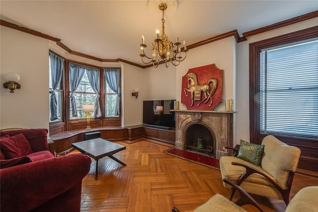 living room featuring ornamental molding, a fireplace, a wealth of natural light, and light parquet floors