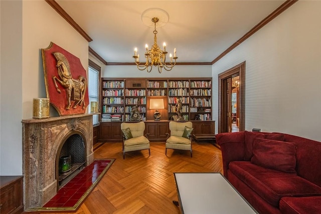 sitting room featuring a notable chandelier, parquet floors, a fireplace, and ornamental molding