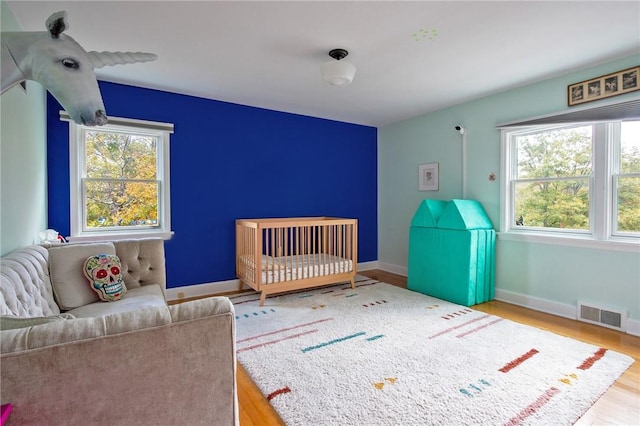 bedroom with light wood-type flooring