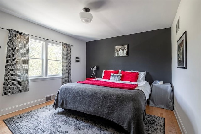 bedroom featuring hardwood / wood-style flooring