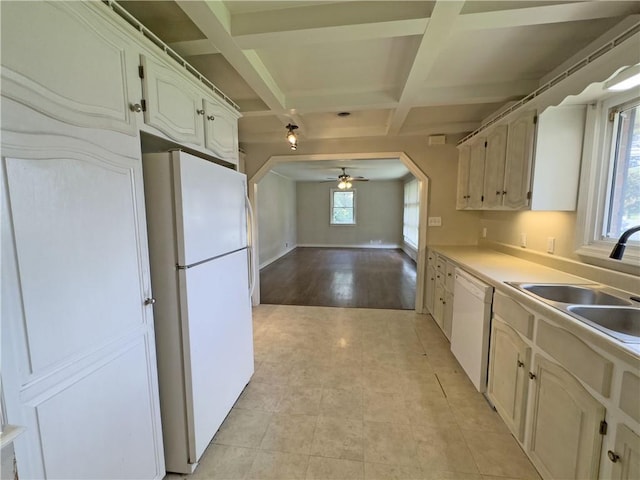 kitchen with coffered ceiling, plenty of natural light, light hardwood / wood-style floors, and white appliances