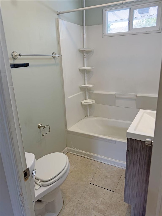 full bathroom featuring tile patterned flooring, shower / bathing tub combination, vanity, and toilet