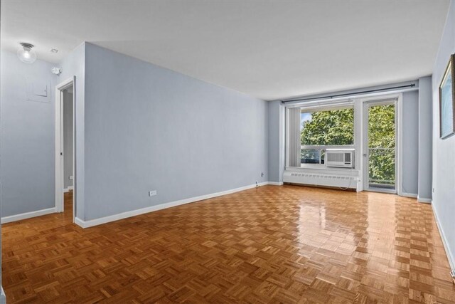 2575 Palisade Ave Unit 2J, Bronx, NY 10463 - unfurnished room with baseboards and a baseboard radiator
