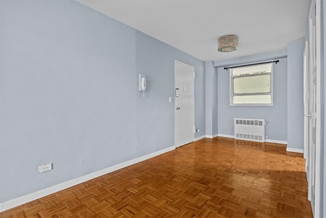 2575 Palisade Ave Unit 2J, Bronx, NY 10463 - spare room with radiator and baseboards