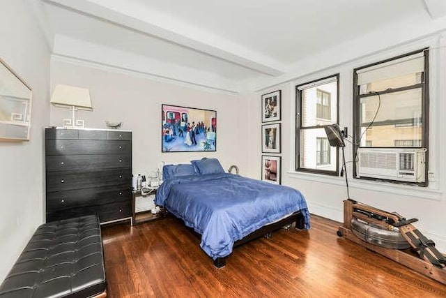 bedroom featuring beamed ceiling, cooling unit, and dark wood-type flooring