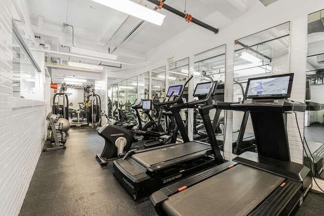 gym with brick wall