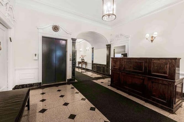 entryway featuring ornamental molding