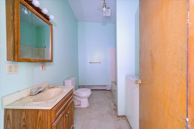 bathroom featuring toilet, vanity, concrete flooring, and a baseboard heating unit