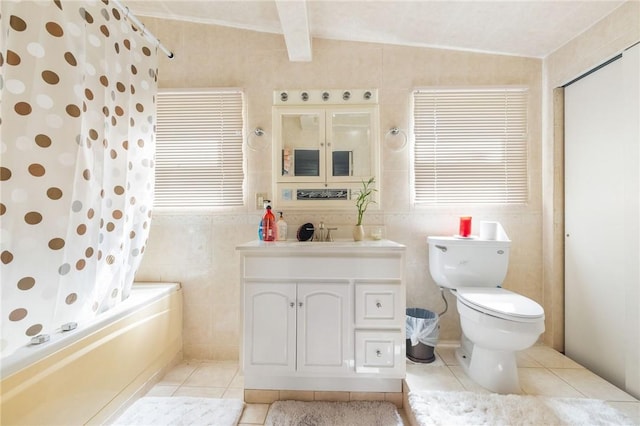 full bathroom featuring lofted ceiling with beams, tile patterned floors, shower / tub combo with curtain, vanity, and tile walls