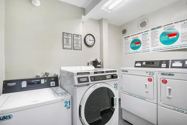 laundry room featuring washer and clothes dryer