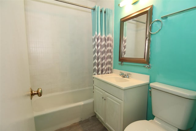 full bathroom featuring vanity, toilet, and tiled shower / bath