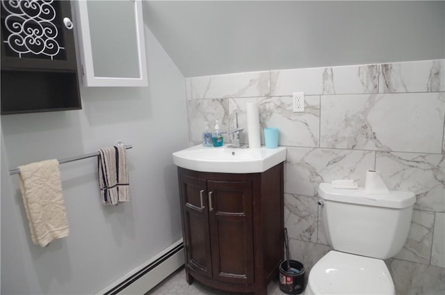 bathroom with vanity, toilet, tile walls, and a baseboard radiator