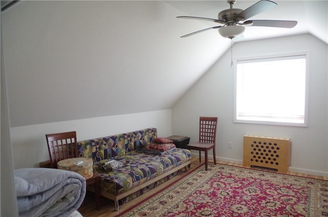 interior space with ceiling fan and vaulted ceiling