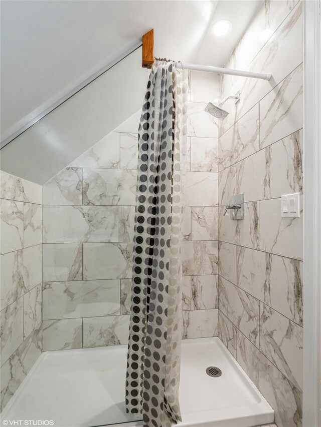 full bathroom featuring a shower stall