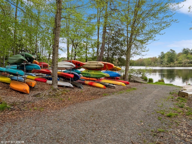 view of parking / parking lot featuring a water view