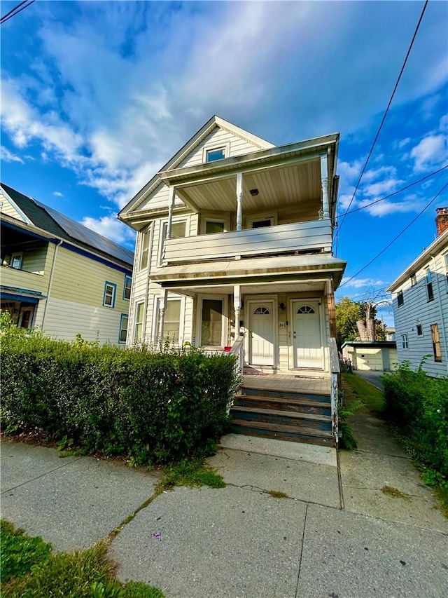 view of front facade with a porch and a balcony