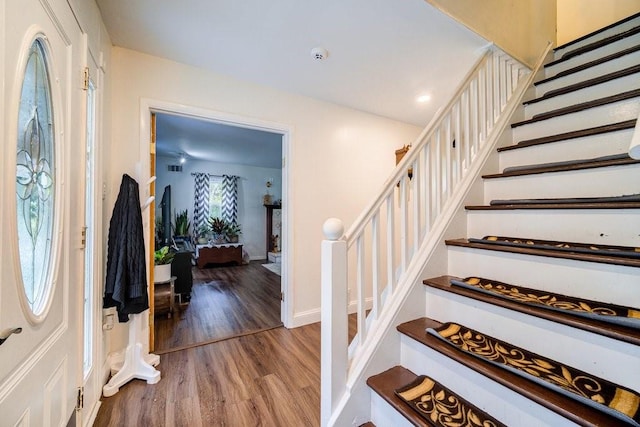 entryway with hardwood / wood-style floors