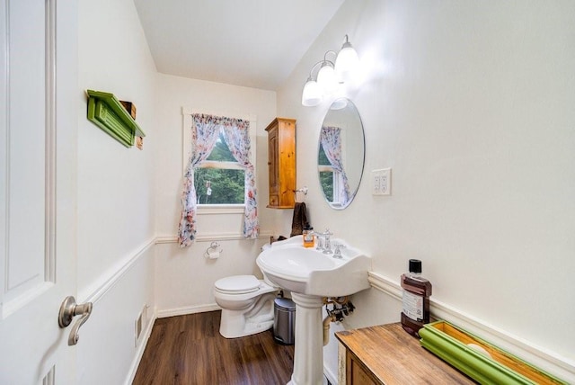 bathroom featuring sink, hardwood / wood-style floors, and toilet