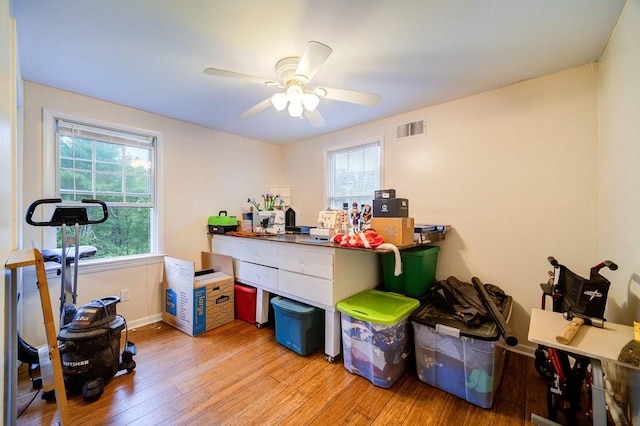 misc room featuring light hardwood / wood-style flooring and ceiling fan