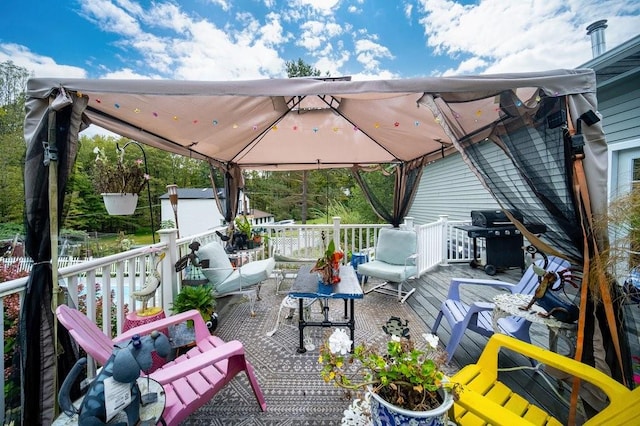 deck featuring a gazebo and a grill