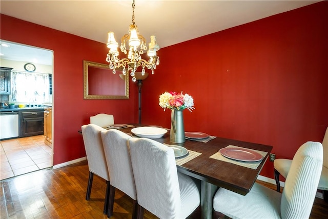 dining room featuring a chandelier and light hardwood / wood-style floors