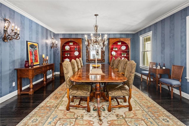 dining room featuring ornamental molding, hardwood / wood-style flooring, and a notable chandelier