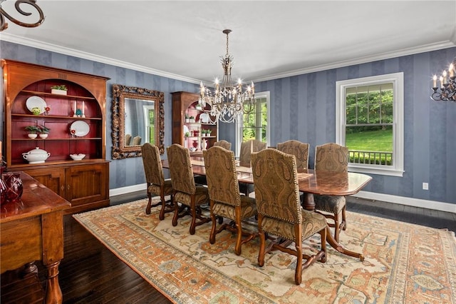 dining area featuring crown molding, dark wood-type flooring, and a notable chandelier