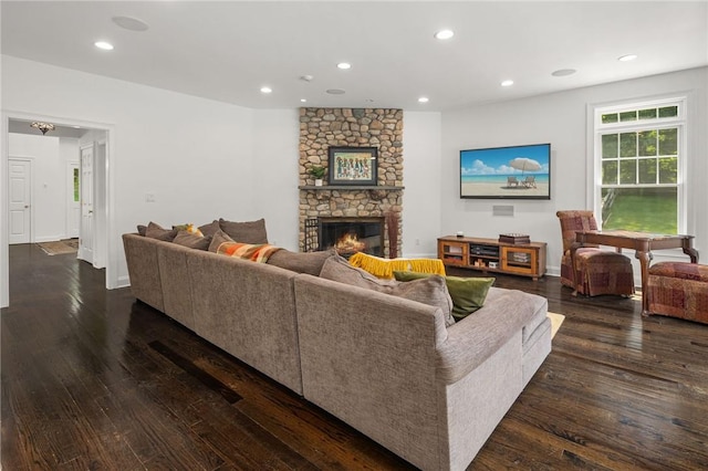 living room featuring a fireplace and dark hardwood / wood-style flooring