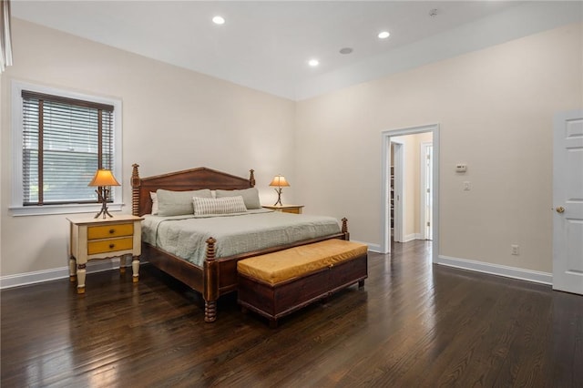 bedroom with dark hardwood / wood-style floors