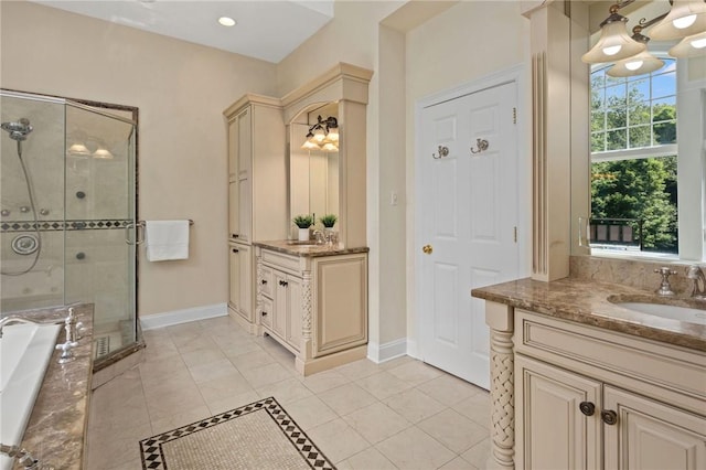 bathroom featuring a wealth of natural light, tile patterned flooring, vanity, and shower with separate bathtub