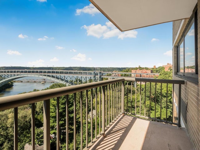 balcony featuring a water view