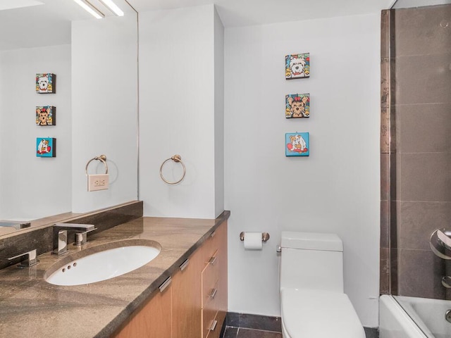 bathroom with tile patterned floors, vanity, and toilet