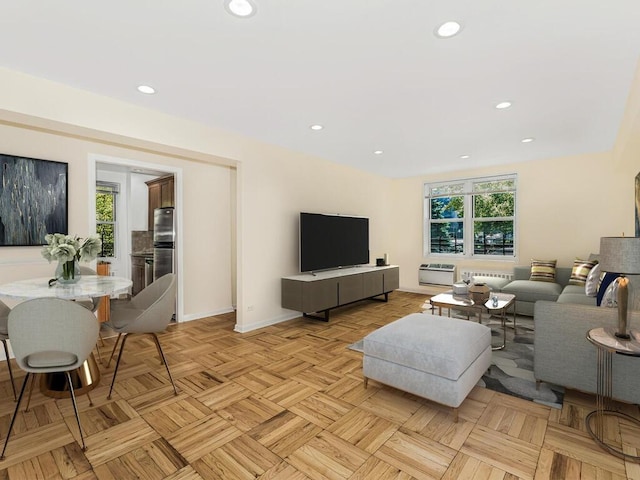 living room with light parquet flooring and a healthy amount of sunlight