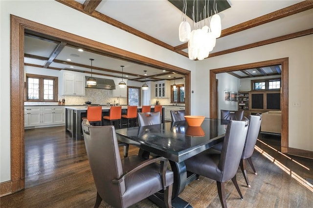 dining area with coffered ceiling, crown molding, dark hardwood / wood-style floors, beamed ceiling, and a chandelier