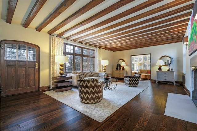 living room featuring beam ceiling and dark wood-type flooring