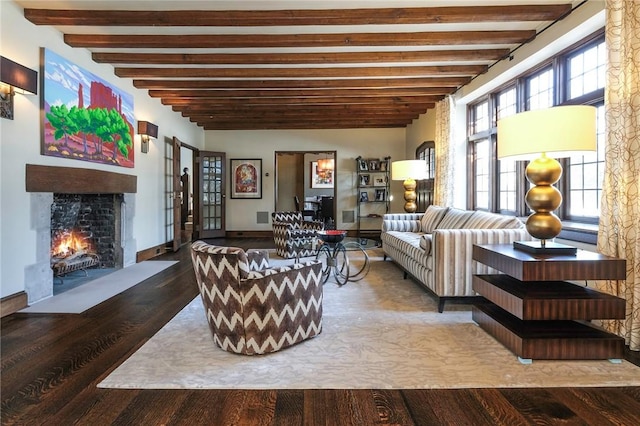 living room featuring beamed ceiling and hardwood / wood-style floors