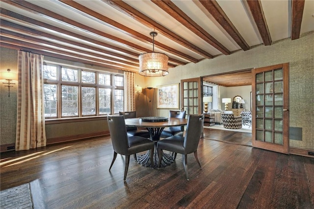 dining area with french doors, dark wood-type flooring, and beam ceiling