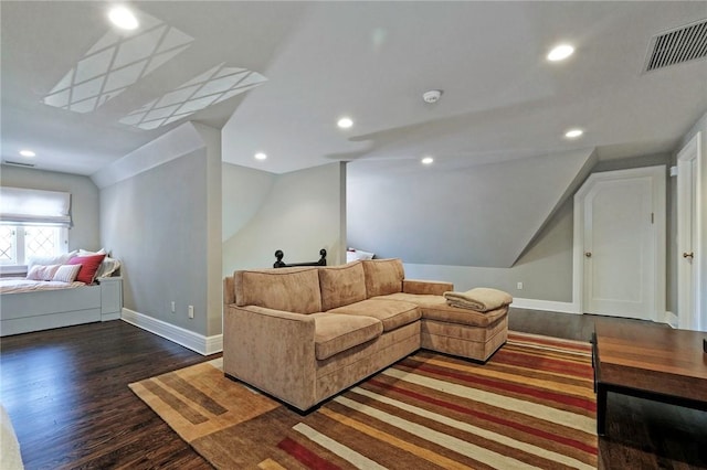 living room with dark hardwood / wood-style flooring and vaulted ceiling