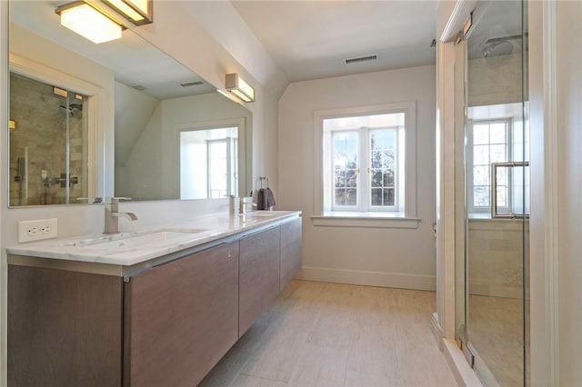 bathroom with vanity and walk in shower