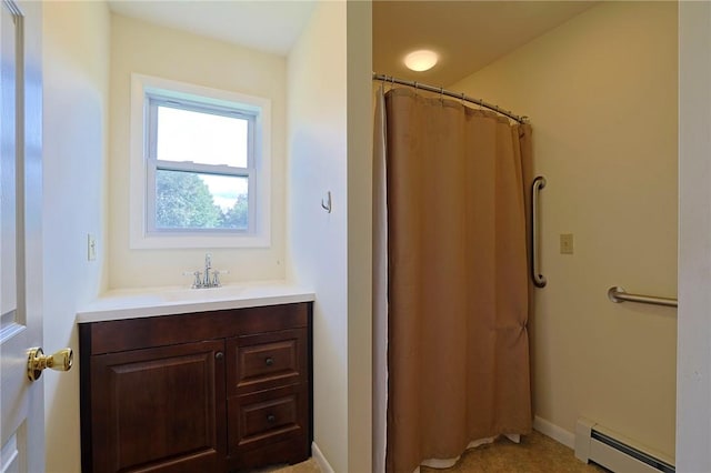 bathroom featuring a shower with shower curtain, vanity, and a baseboard radiator