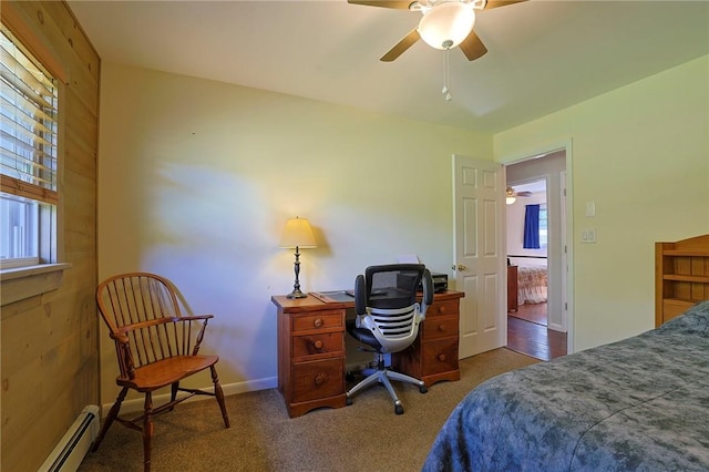 bedroom with dark colored carpet, ceiling fan, multiple windows, and a baseboard radiator