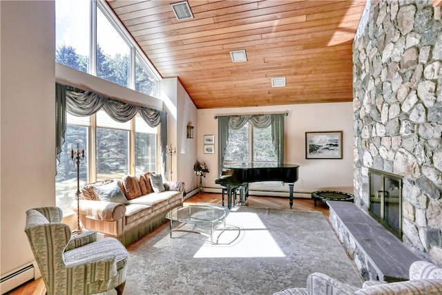 living room with a baseboard radiator, high vaulted ceiling, light hardwood / wood-style flooring, wooden ceiling, and a stone fireplace