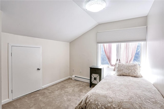 bedroom featuring baseboard heating, light carpet, and vaulted ceiling