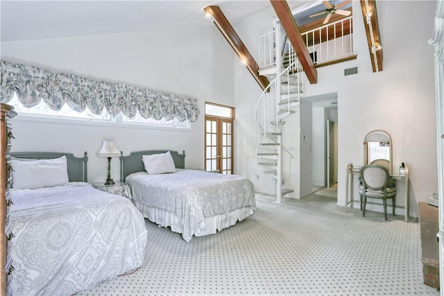 bedroom with carpet flooring, high vaulted ceiling, and multiple windows